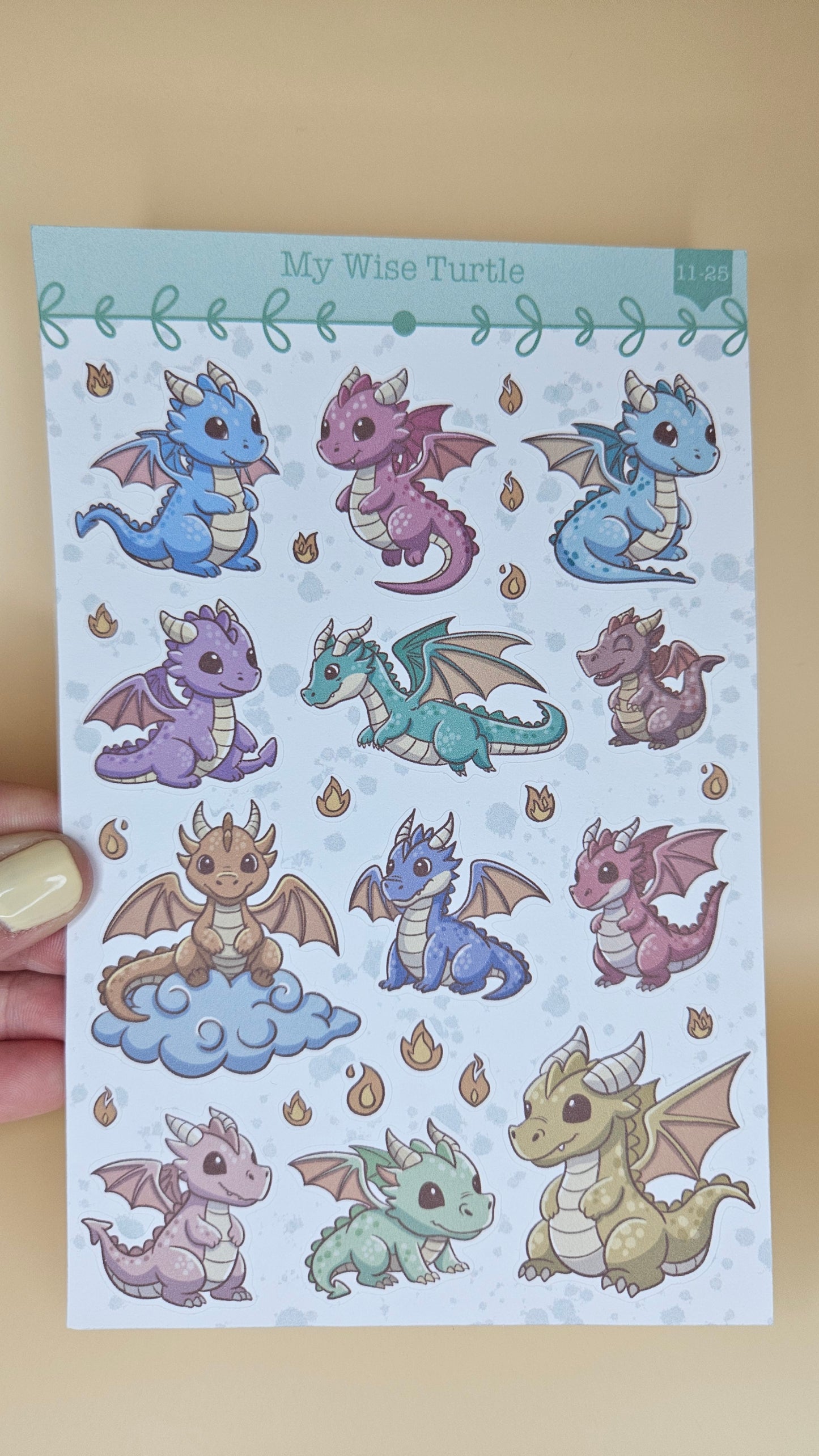 Sheet of dragon stickers with colorful designs on a light blue background