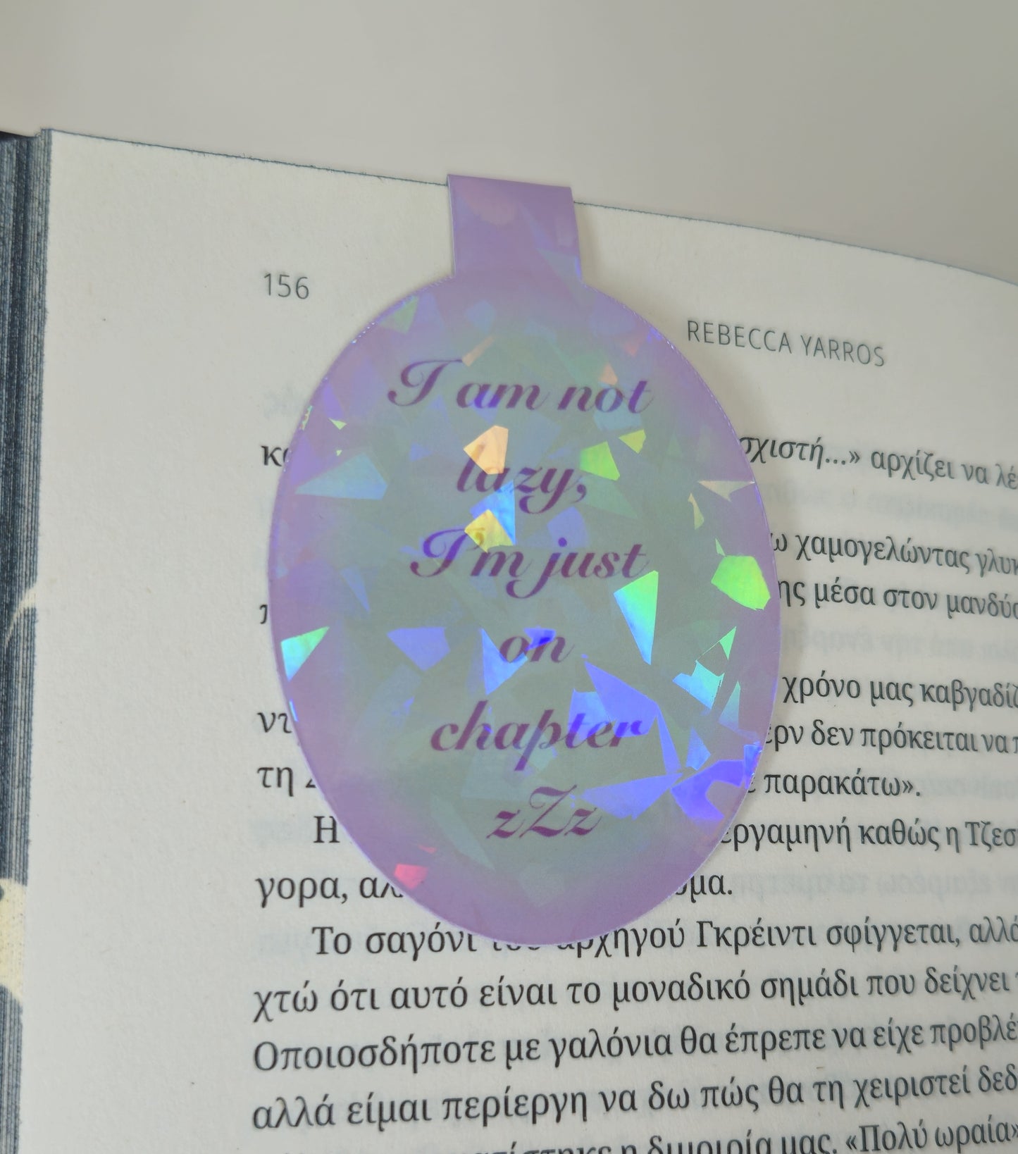 Holographic bookmark with text on a book page