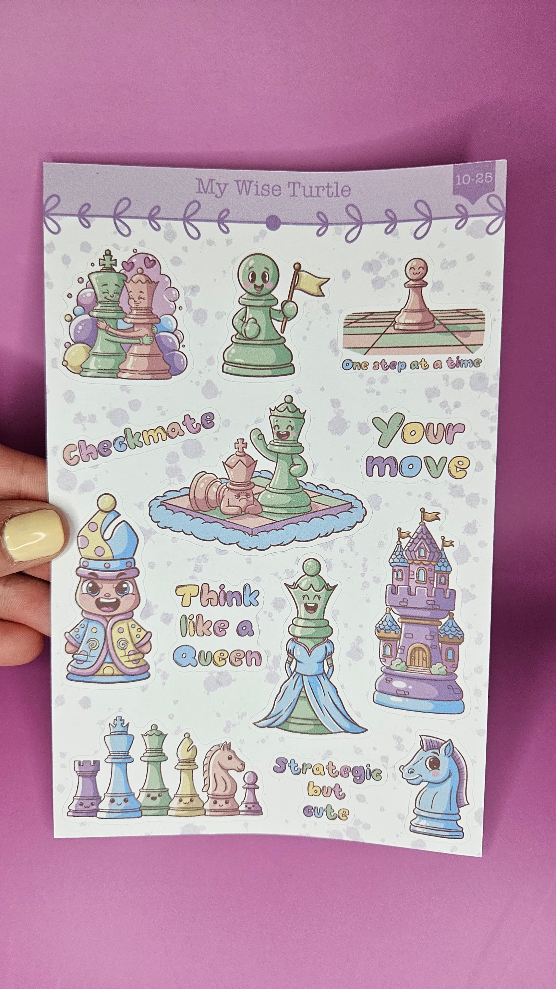 Sheet of colorful chess piece stickers held against a pink background